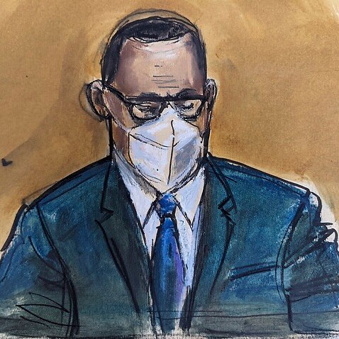 In this courtroom sketch, R. Kelly listens as the jury foreperson reads the verdict