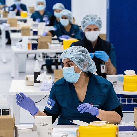 SYDNEY, AUSTRALIA - MAY 10: Staff prepare COVID-19 vaccines in the pharmacy area at the Olympic Park Vaccination Centre on May 10, 2021 in Sydney, Australia. The mass vaccination centre at Sydney Olympic Park is equipped to administer 30,000 vaccine doses