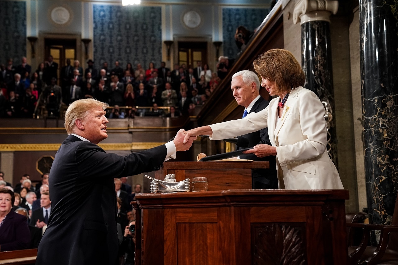 US President Donald Trump shakes hands with Speaker of the House Nancy Pelosi.