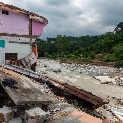 A shop is completely damaged due to flash floods caused by heavy rains in the past few days in Dharmsala, India