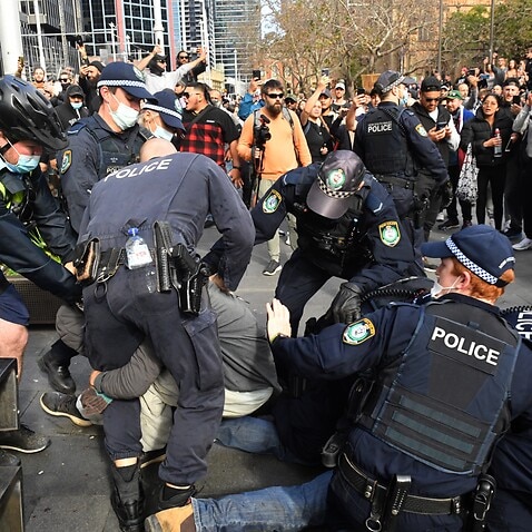 Protesters are arrested by the police at Sydney Town Hall during the ‘World Wide Rally For Freedom’ anti-lockdown rally at Hyde Park in Sydney, 24 July, 2021. 