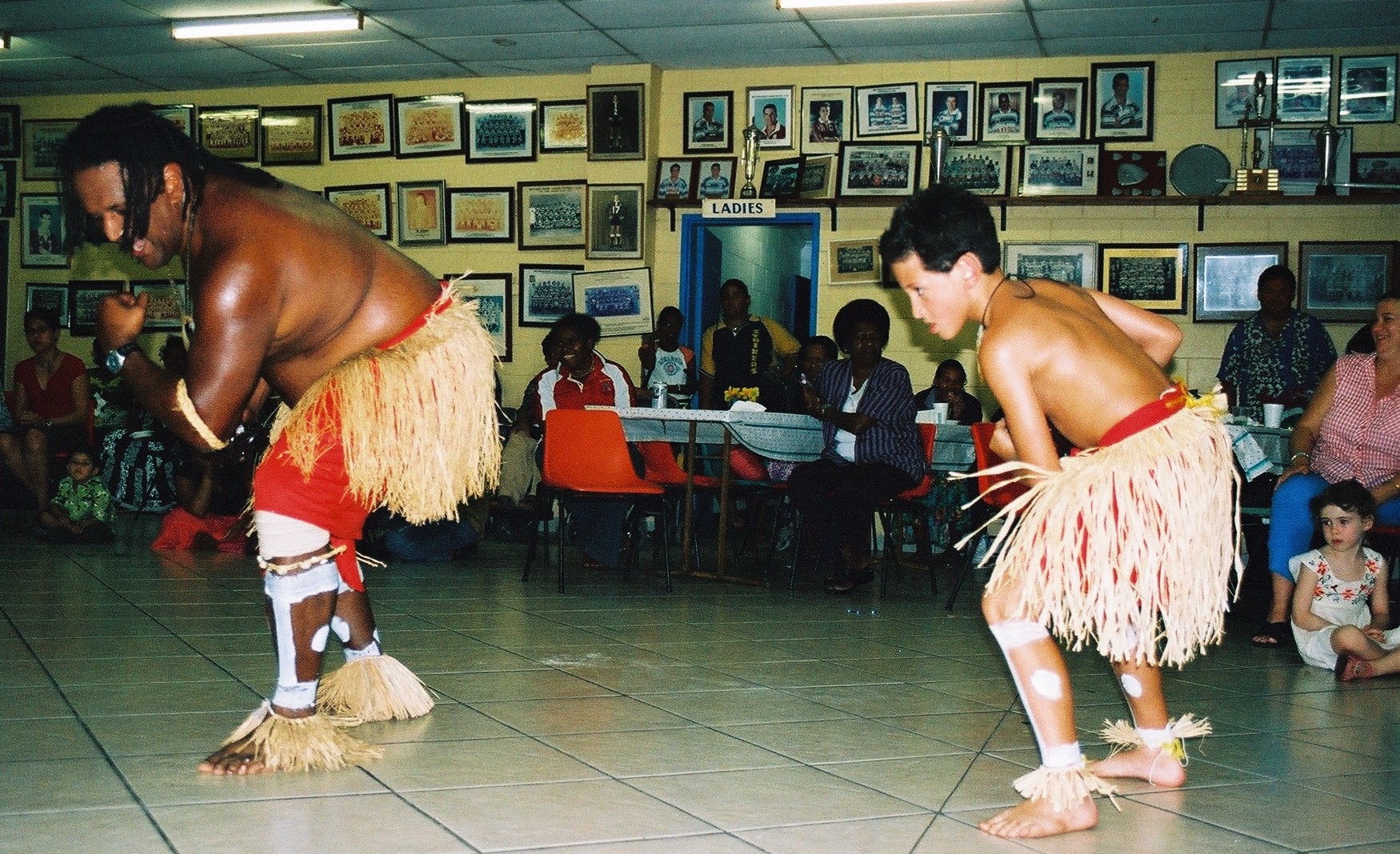 Tainga dancing with his father. 