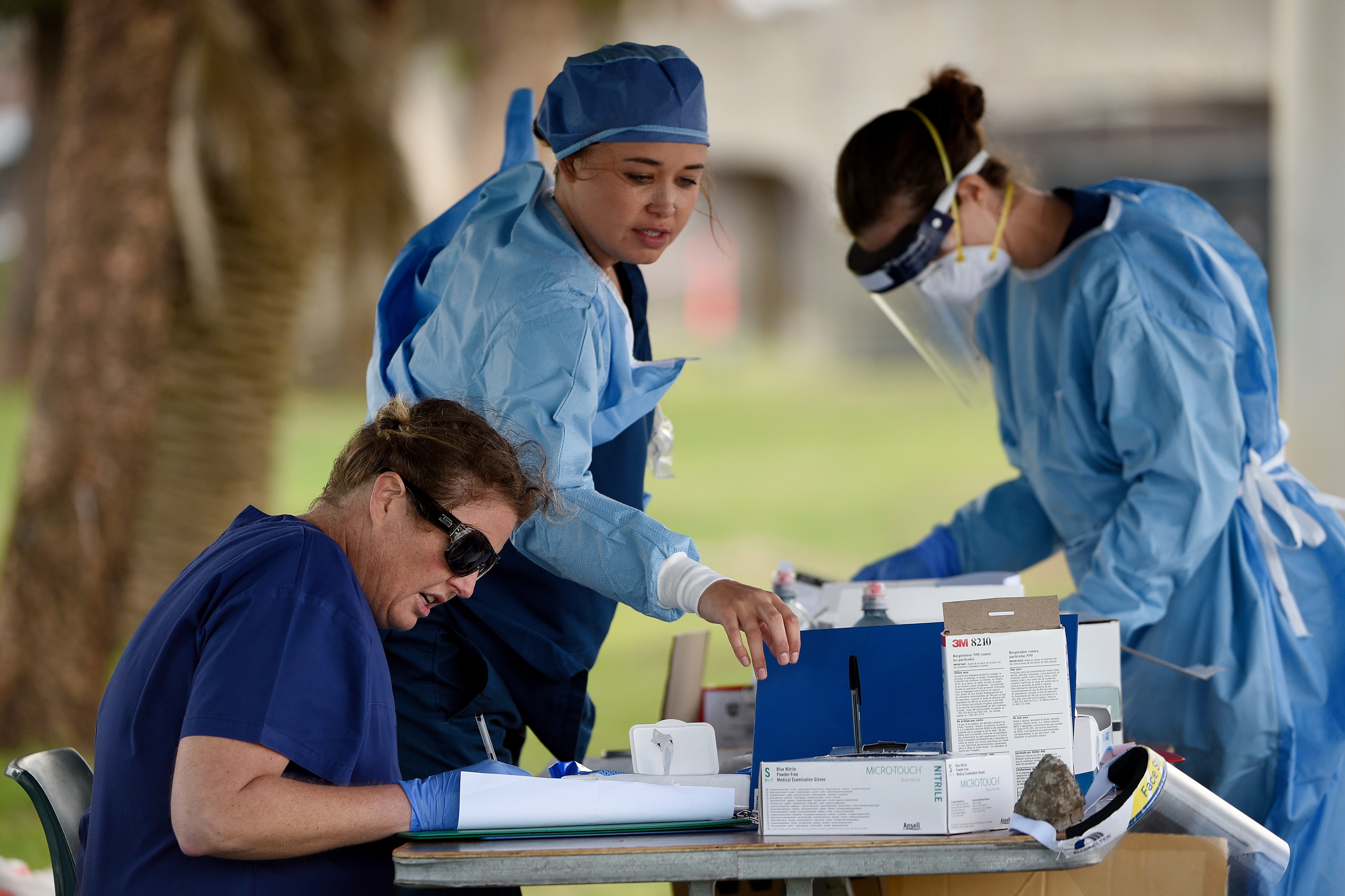 Medical professionals prepare tests at the Bondi Beach drive-through COVID-19 testing centre in Sydney.