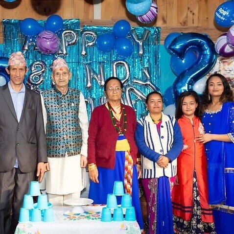 Writer Ashna Thapa's (far-right) family celebrating her late grandfather's 82nd birthday. 