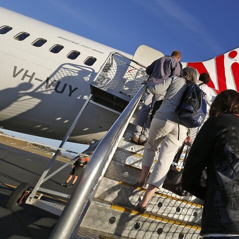 A file photo showing passengers boarding  a Virgin Australia plane at Hobart International  Airport, Tasmania.
