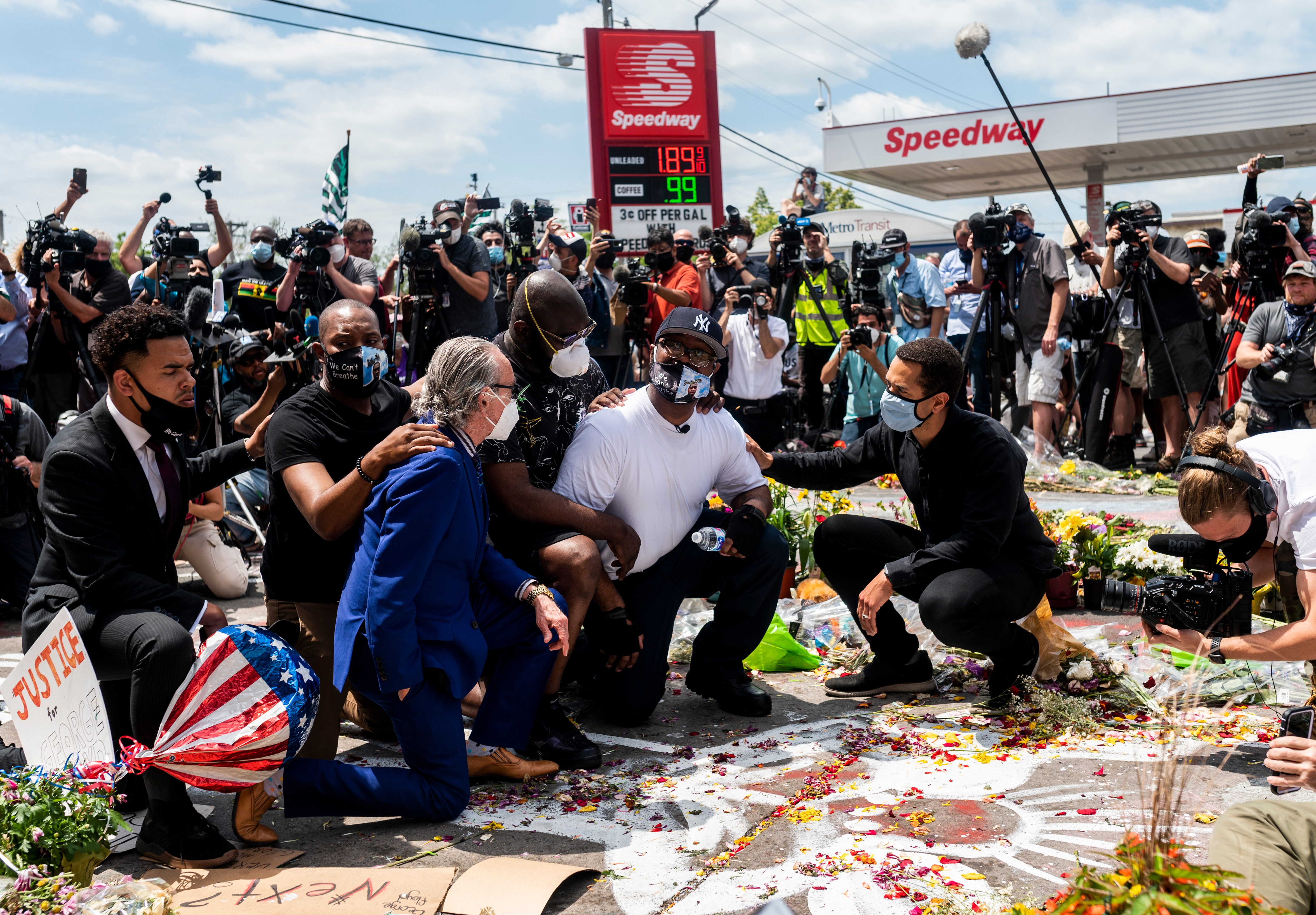 Terrence Floyd knelt to pray at the spot where his brother died one week earlier. Terrence Floyd knelt to pray at the spot where his brother died one week earlier.