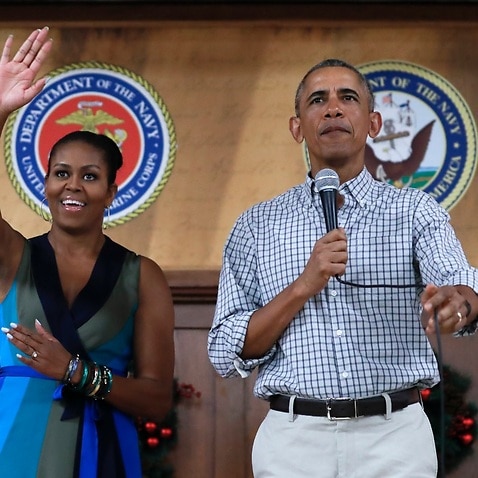 President Barack Obama and first lady Michelle Obama, arrive for an event to thank service members and their families at Marine Corps Base Hawaii on December 25