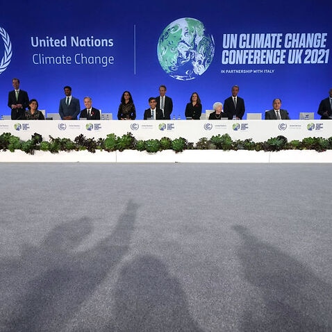 World leaders pose for a picture at the COP26 climate summit in Glasgow, 3 November 2021.