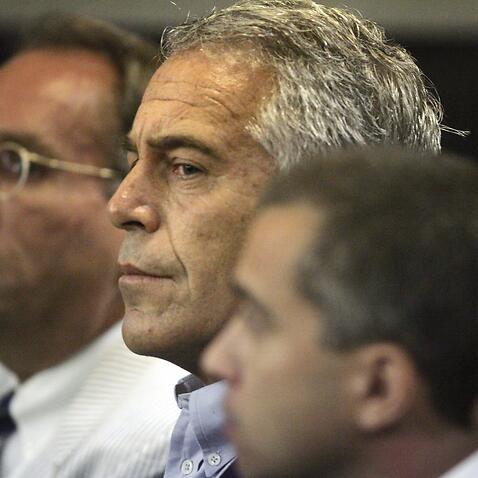 2 guards suspended and warden reassigned after Epstein death