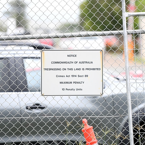 A warning sign on the fence of the Brisbane Immigration Transit Accommodation, where a number of Medevac transferees are held. 