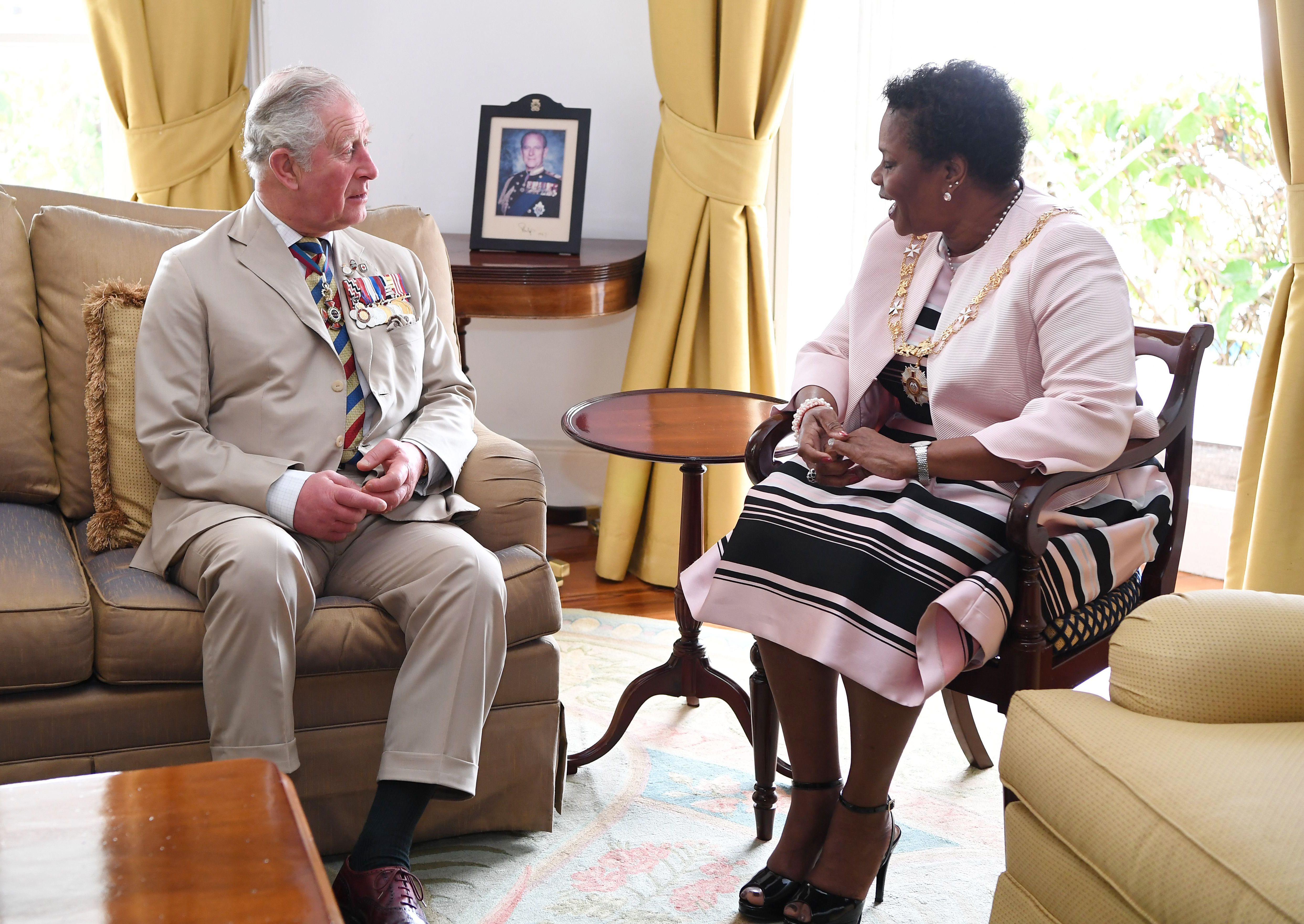 Prince Charles attends a meeting with Barbados' then-Governor General Dame Sandra Mason. 