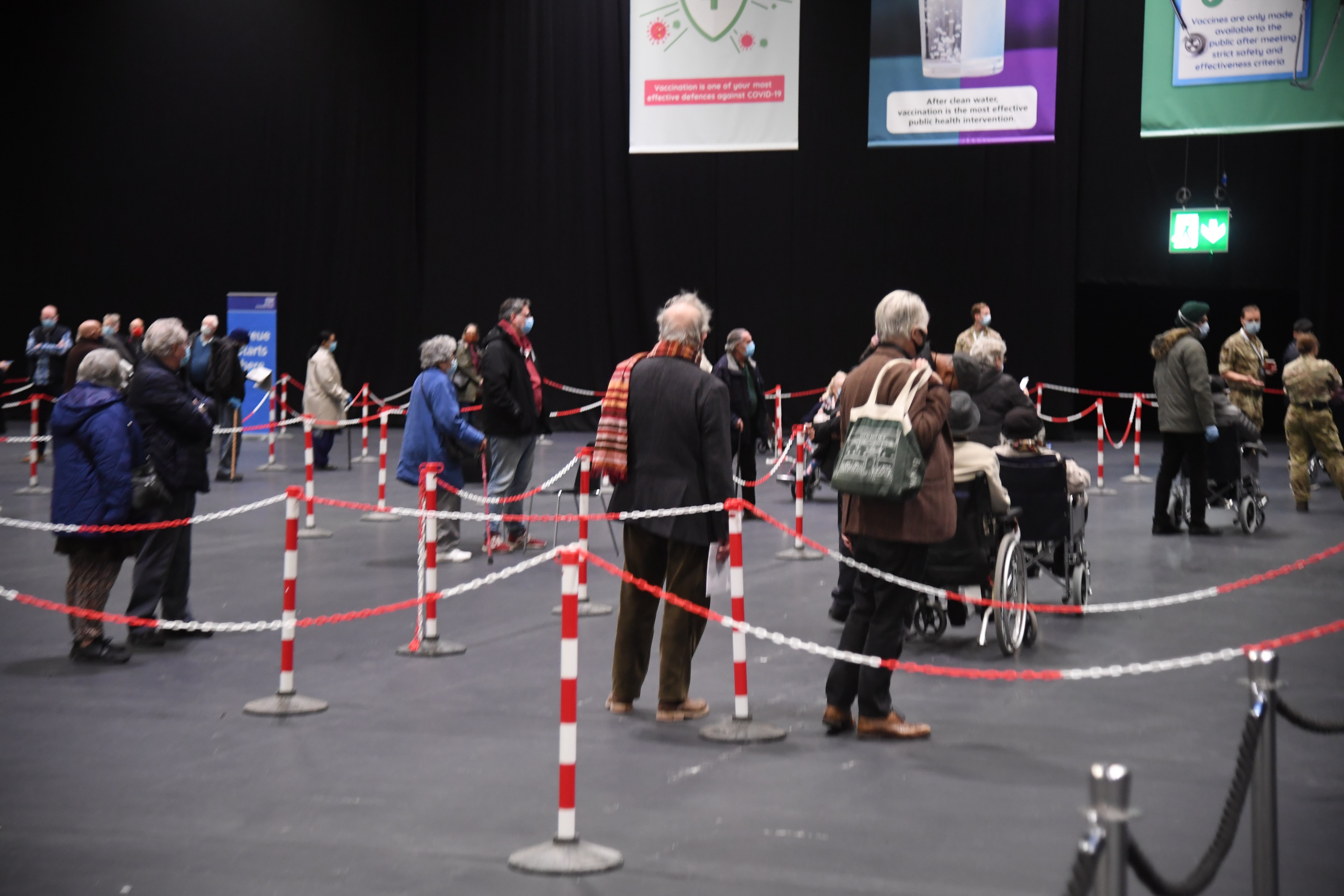 Londoners queue up a mass vaccination centre.