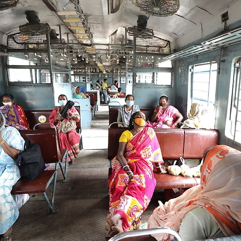 Passengers are seen in a train car during a rush hour in Kolkata. eastern India, 4 May 2021.