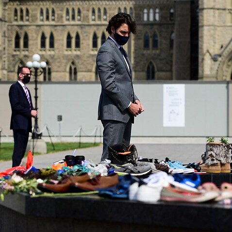 Canadian Prime Minister Justin Trudeau visits a memorial at the Eternal Flame on Parliament Hill in Ottawa 