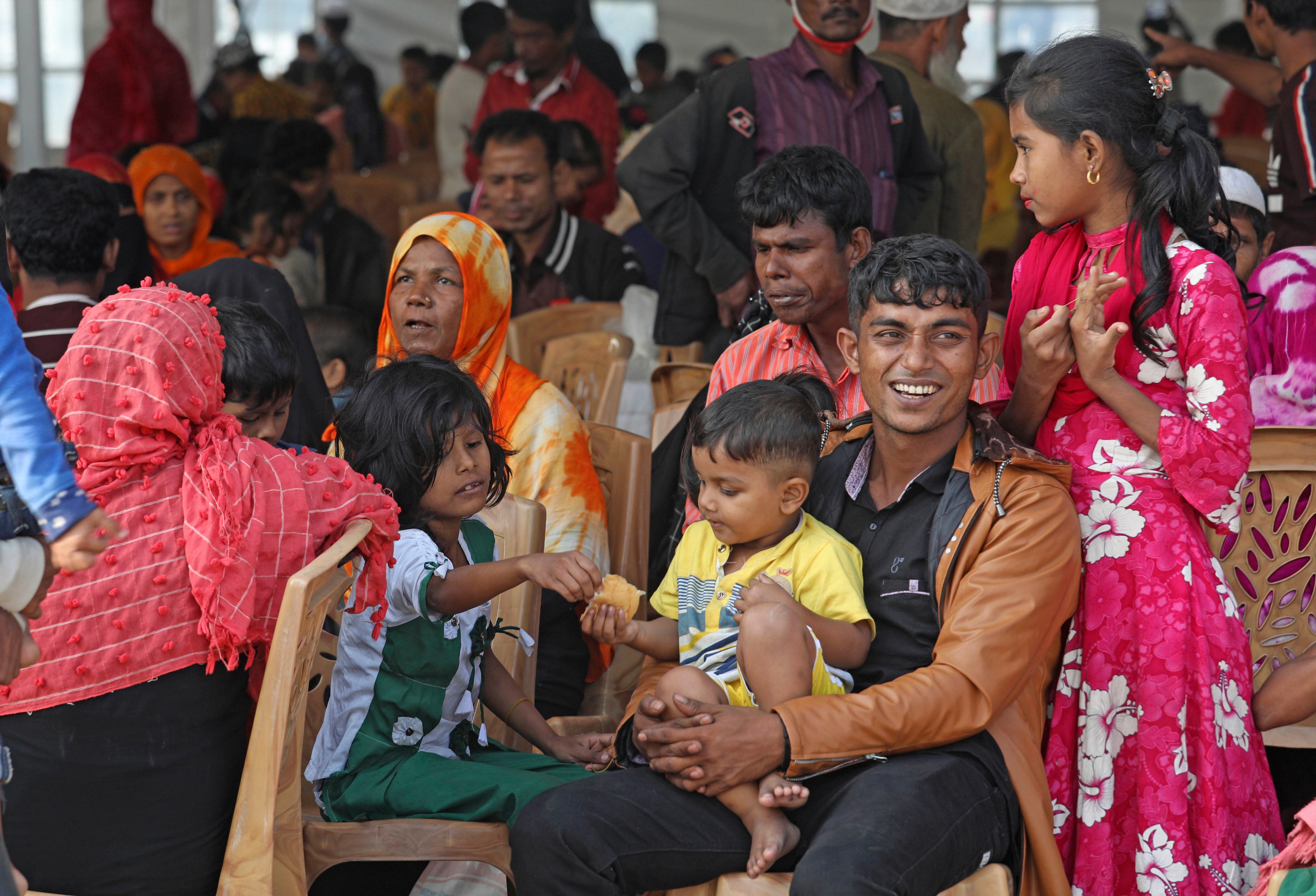 Rohingya refugees wait to be transported on a naval vessel to Bhashan Char from Chittagong, Bangladesh, on 4 December.