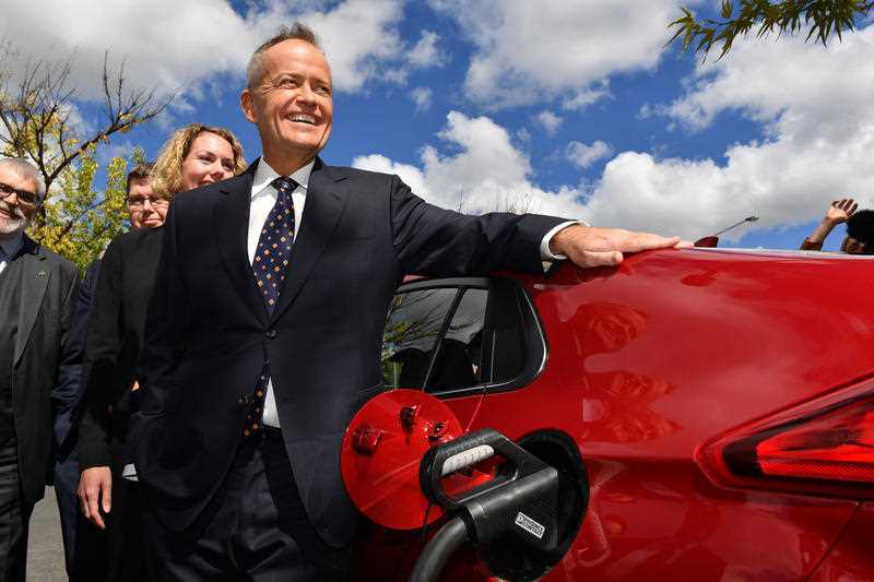 Opposition Leader Bill Shorten charges an electric car in Canberra.