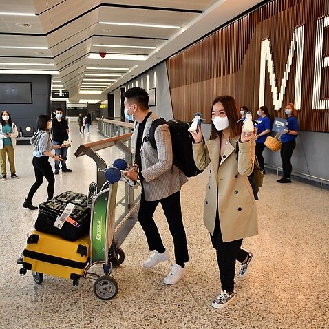 Passengers on a Singapore Airlines flight arrive at Melbourne International Airport in Melbourne, Sunday, November 21, 2021. 