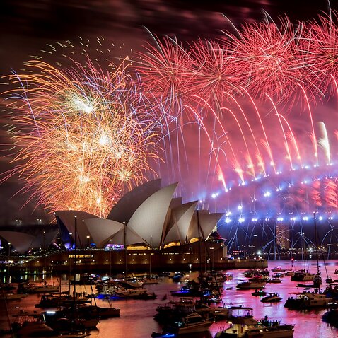 Fireworks explode over the Sydney Harbour during New Year's Eve celebrations in Sydney, Tuesday, January 1, 2019. (AAP Image/Brendan Esposito) NO ARCHIVING