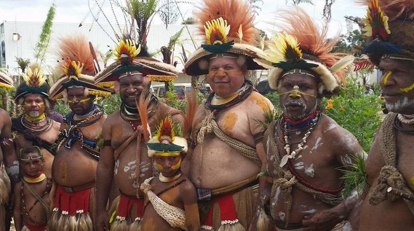 James Marape (4th from left) and Huli wigmen.