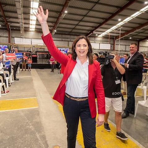 Queensland Premier Annastacia Palaszczuk is seen waving to supporters at The Blue Fin Fishing Club in Brisbane, Saturday, October 31, 2020.