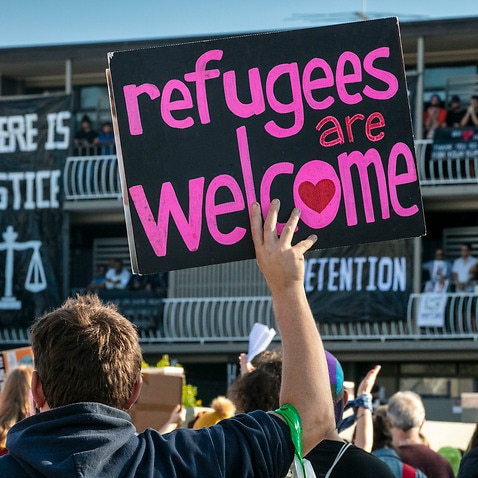 Protesters advocate for asylum seeker rights.