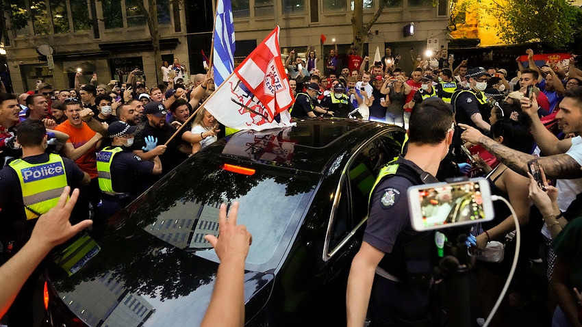 Image for read more article 'Fans pepper sprayed, police injured amid chaotic scenes at protest for Novak Djokovic'