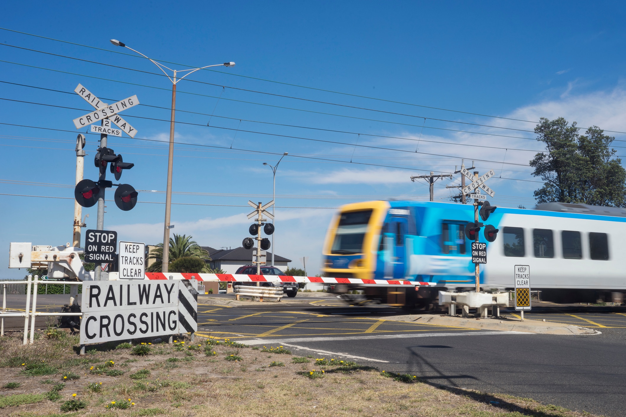 Train going through railway level crossing, Melbourne