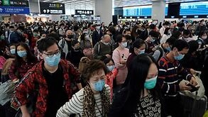 China has locked down millions of people in an effort to keep a lid on the situation. Pictured, people wear face masks at Hong Kong Airport.
