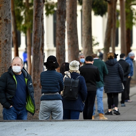 People are seen lining up outside of COVID-19 vaccination centre in Melbourne on 1 June 2021.  