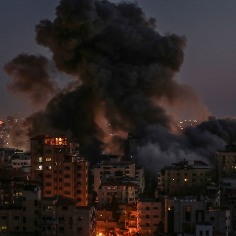 Smoke billows from the Hanadi residential tower in Gaza after it was hit by an Israeli airstrike amid the escalating flare-up of Israeli-Palestinian violence. 