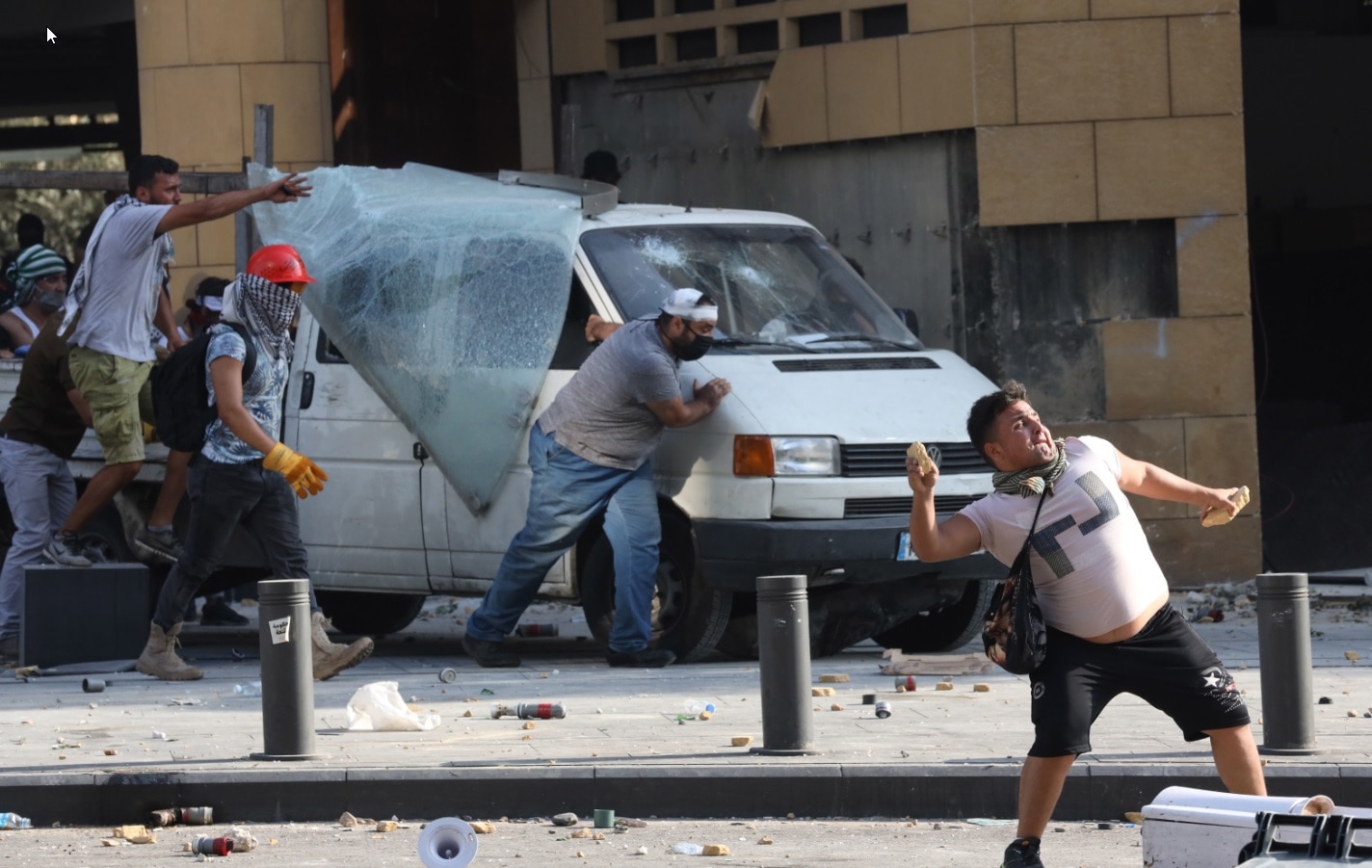 Lebanese anti-government protesters during clashes with riot police during a protest in Beirut, Lebanon, 08 August 2020. Lebanese anti-government protesters during clashes with riot police during a protest in Beirut, Lebanon, 08 August 2020.