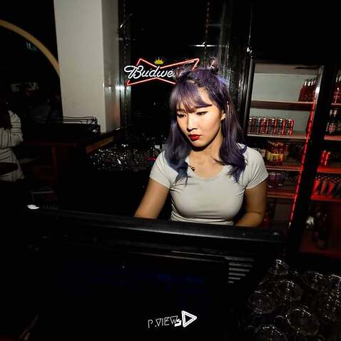 Thai student working in the bar