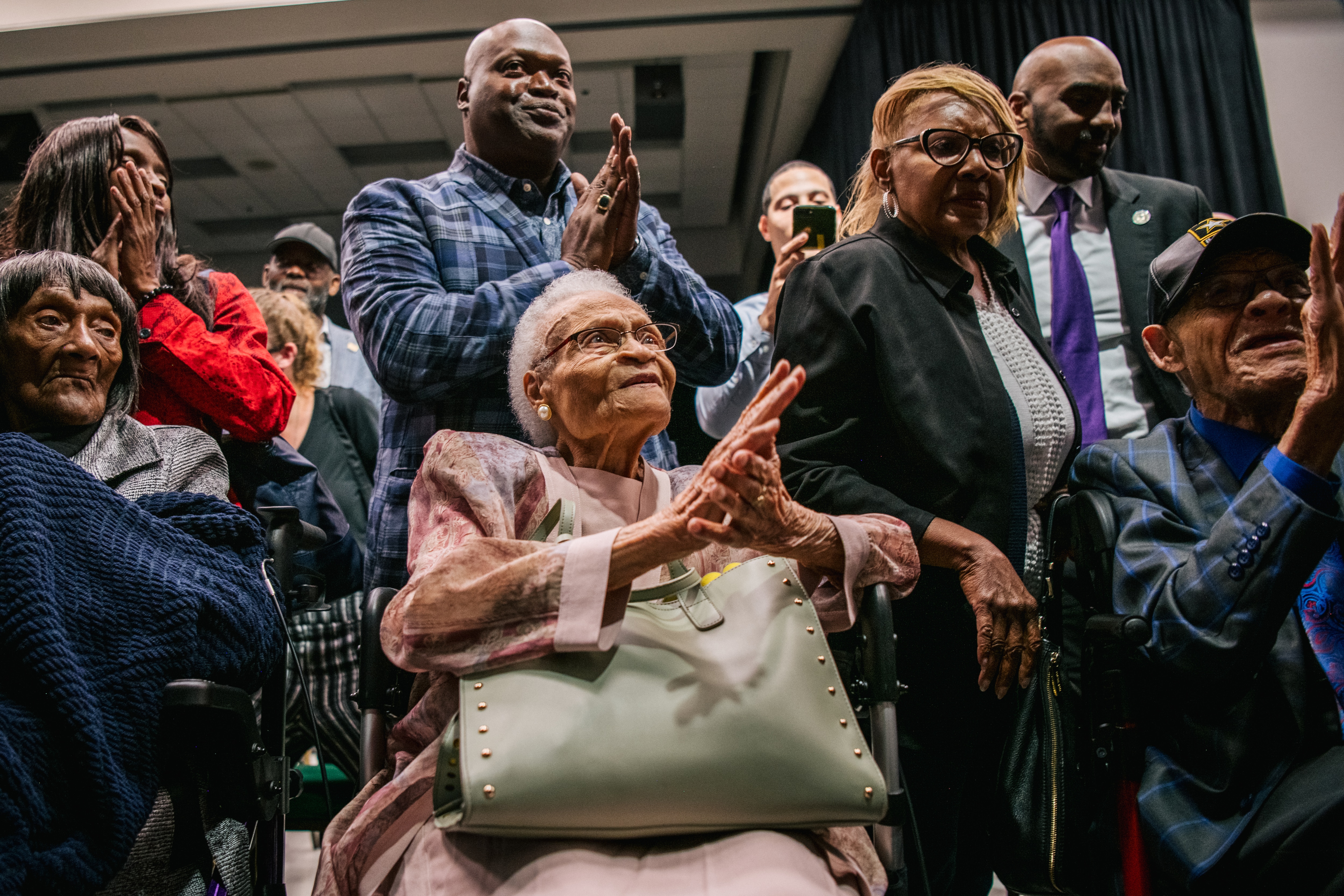 Survivors Lessie Benningfield Randle, Viola Fletcher, and Hughes Van Ellis sing together at commemorations of the 100th anniversary of the Tulsa Race Massacre.