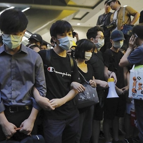 Protesters block the lobby of the Hong Kong Revenue Tower.