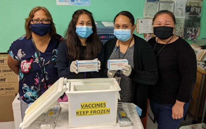Esther Muna (left) and her team in the CNMI with some of the first doses to arrive in the region.