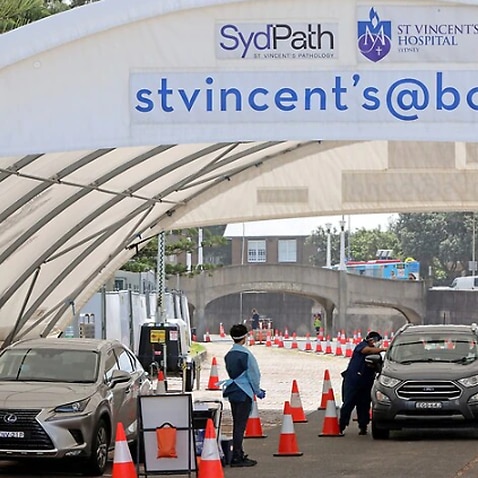 People are tested for COVID-19 at a drive through facility in Sydney. 