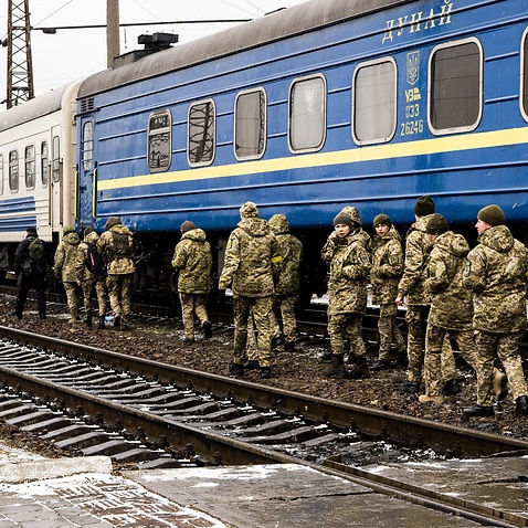 As Russia launched a full-scale invasion of Ukraine, people trying to escape the country passing by Lviv, while others get ready to fight the Russian army.