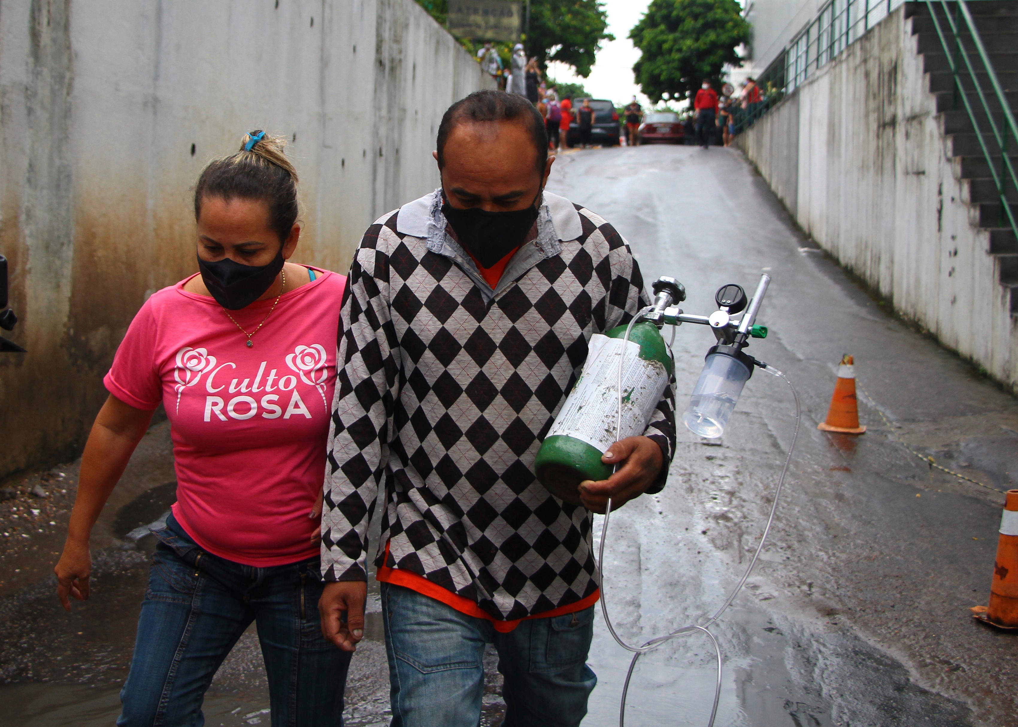 A man carries an oxygen tank at the 28 Agosto Hospital, in Manaus, Brazil, Thursday, Jan 14, 2021. 