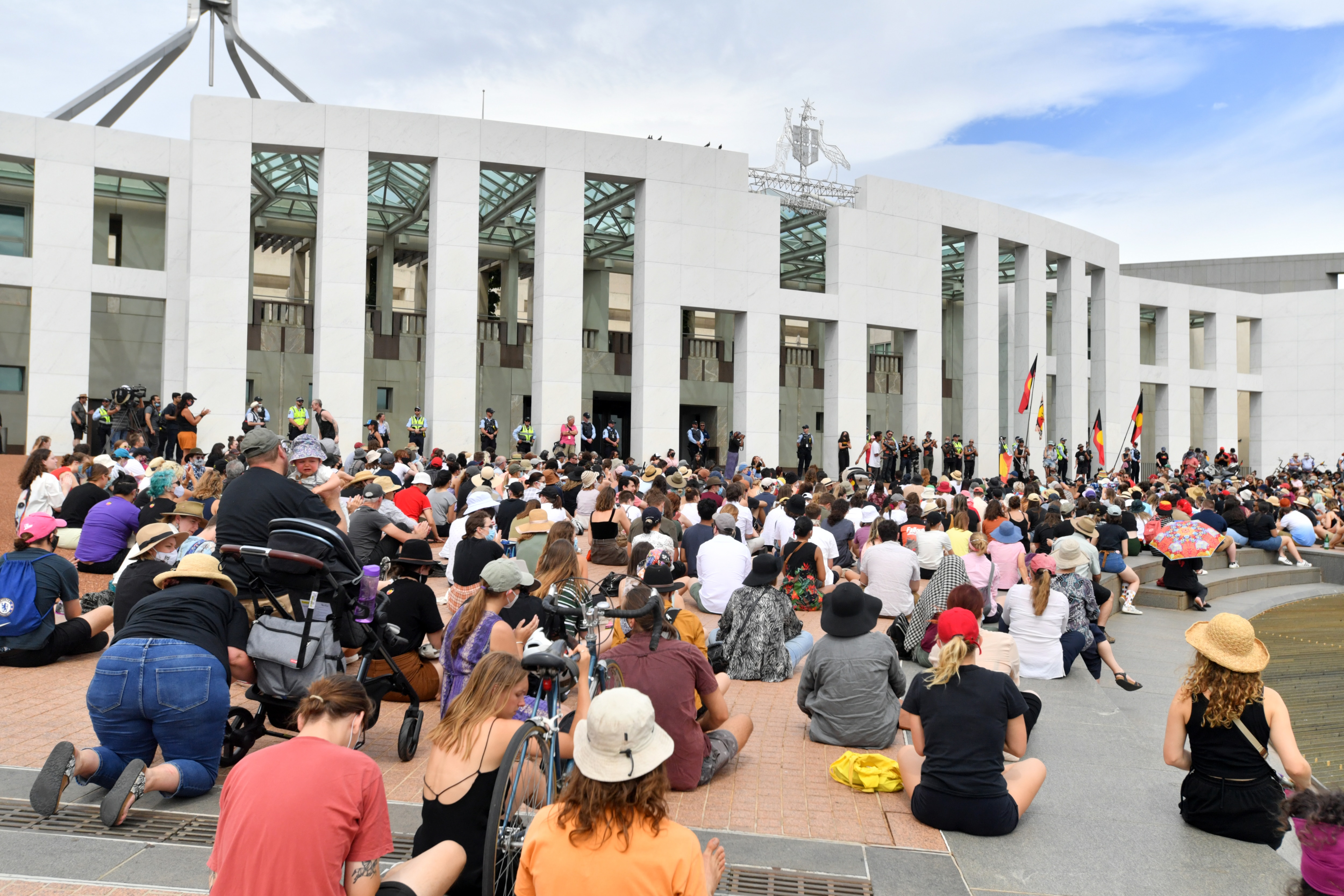 Protesters stage a sit-in outside Parliament House.