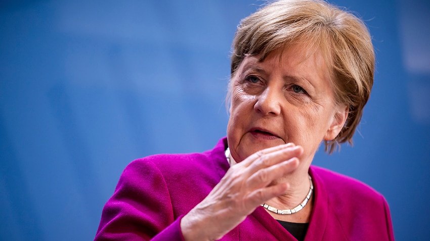 German Chancellor Angela Merkel said the economic and social upheaval from the pandemic has turned the world upside down.