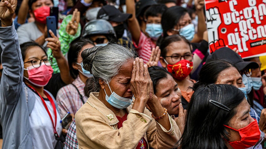 An elderly woman in grief outside the court building in Mandalay, Myanmar.