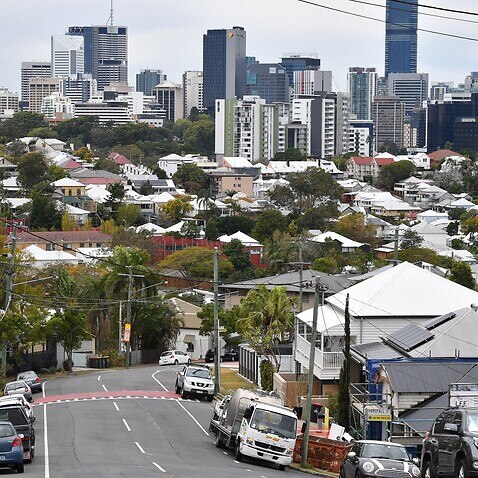 The suburbs of Paddington and Petrie Terrace are seen with the Brisbane CBD skyline in the background in Brisbane, Thursday, August 29, 2019. (AAP Image/Darren England)