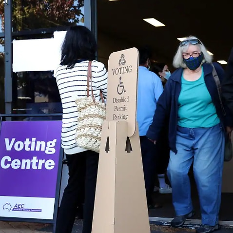 Voters queue outside an Australian Electoral Commission early voting centre in Willetton in the Federal electorate of Tangney in Perth, Tuesday, 17 May, 2022. 