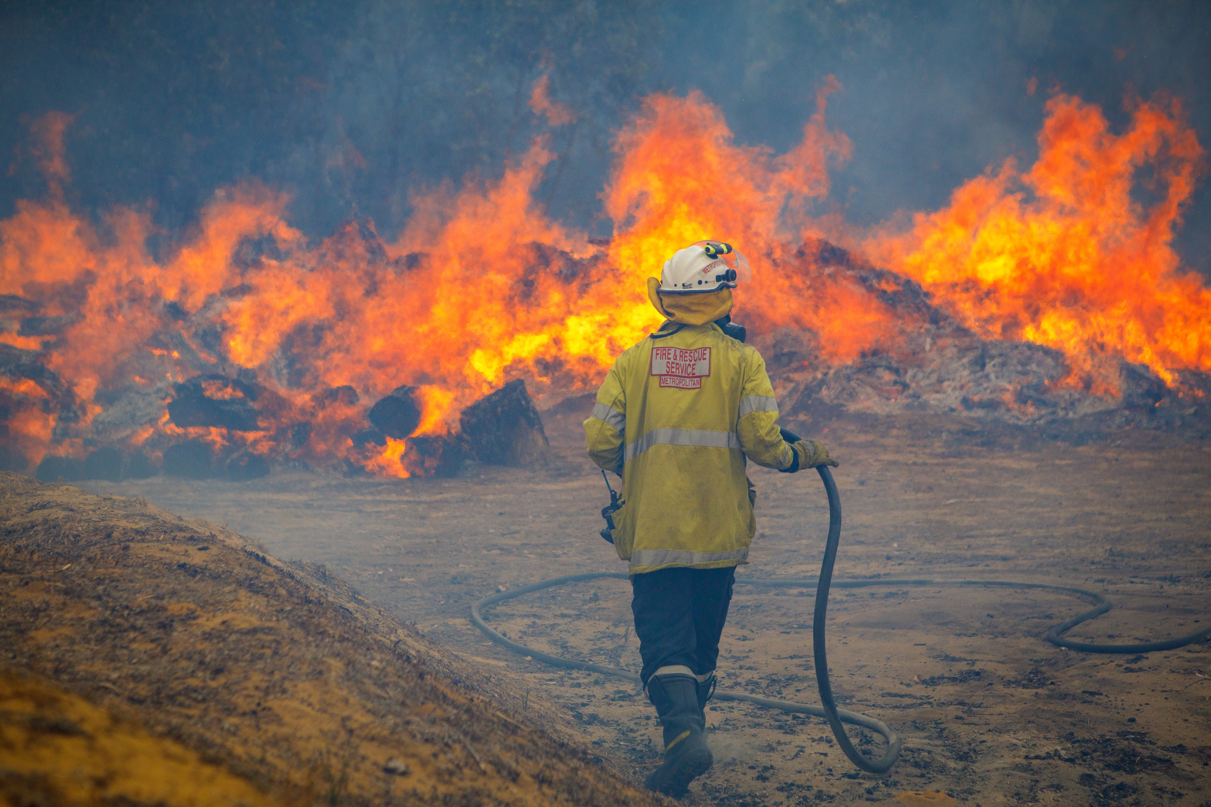 Fire crews battle a bushfire in Yanchep, Western Australia.