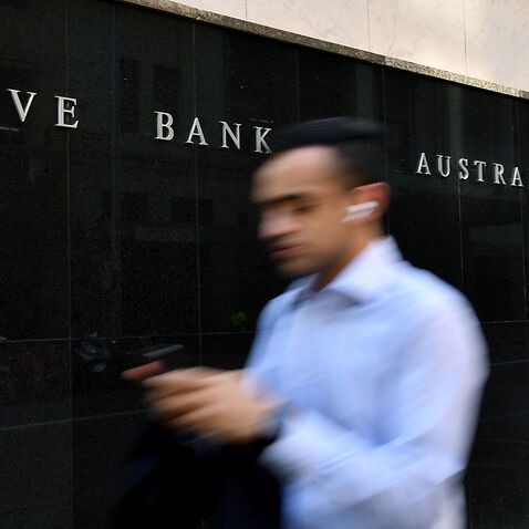 A pedestrian walks past the Reserve Bank of Australia (RBA) building in Sydney.
