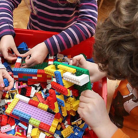 Children playing with LEGO building bricks