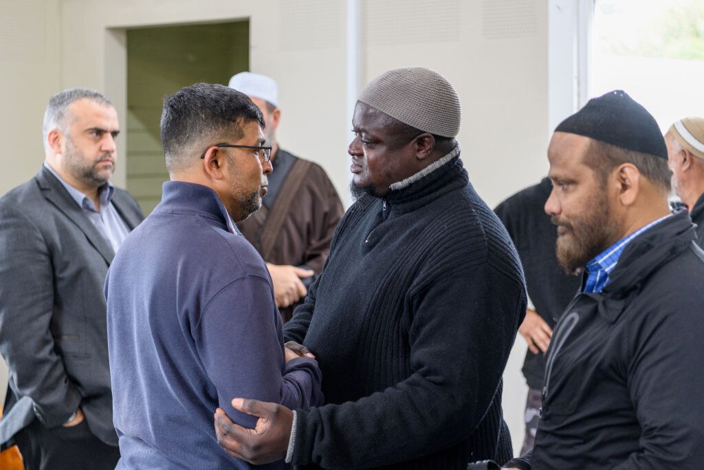 Mazharuddin Syed Ahmed speaks with Imam Alabi Lateef Zirullah at the Linwood Islamic Centre. 