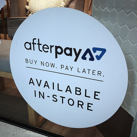 An Afterpay sign is seen in a store window in a shopping centre in Sydney, Tuesday, February 26, 2019.