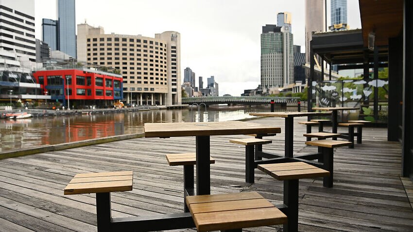 Empty outside dining tables in South Wharf are seen on 17 October, 2021 in Melbourne.