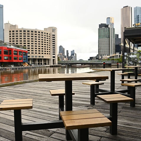 Empty outside dining tables in South Wharf are seen on 17 October, 2021 in Melbourne. 